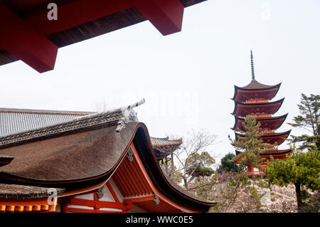 Five-storied Pagoda Gojunoto on Miyajima Island in Japan is coated in red lacquer. Stock Photo