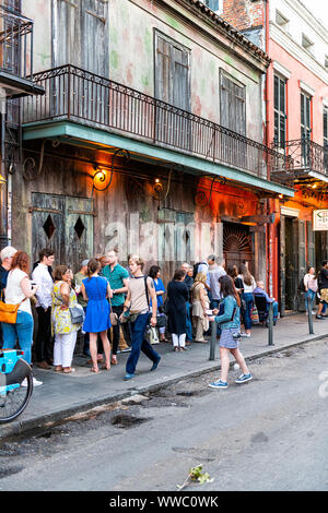 New Orleans, USA - April 22, 2018: People standing in long line waiting for Preservation Hall in old town St Peter Pierre street in Louisiana city Stock Photo