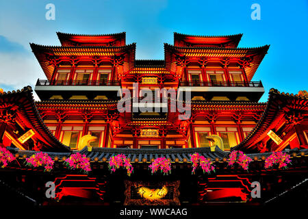 Exterior of Buddha Tooth Relic Temple in Chinatown, Singapore at evening blue hour and lit for Chinese New Year