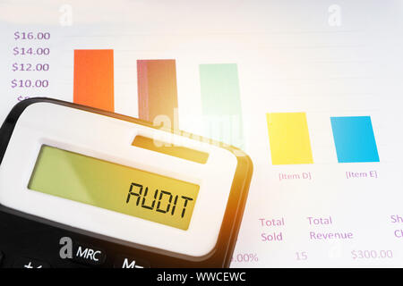 A calculator with the word AUDIT on the display. Selective focus and crop fragment Stock Photo