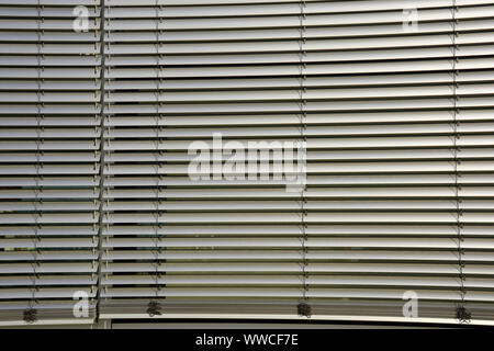 metal blinds outdoor as sun and sight protection, big outside blinds on house facade Stock Photo