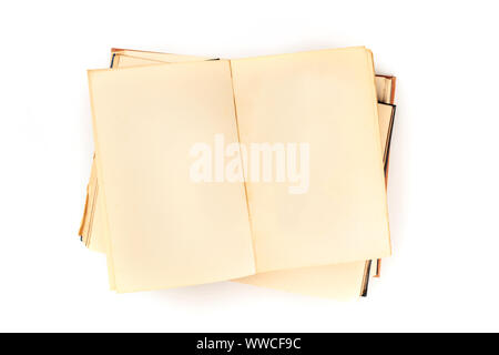 A mock-up of an open old book, a design template with a place for text, a stack of vintage books, shot from the top on a white background Stock Photo