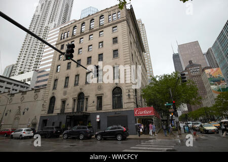 looking down north michigan avenue at the cartier store womans