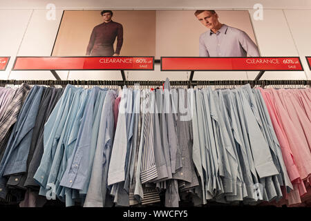 Men's shirts for sale at the Calvin Klein outlet store at the Tanger Mall  in Deer Park, Long Island, New York Stock Photo - Alamy
