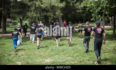 ISTANBUL, TURKEY - Maj 30 - Jun 02. 2019. Large group of international martial arts instructors and students have hard strength energy training on GEN Stock Photo