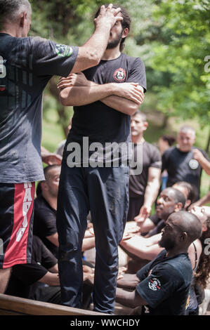 ISTANBUL, TURKEY - Maj 30 - Jun 02. 2019. Large group of international martial arts instructors and students have hard strength energy training on GEN Stock Photo