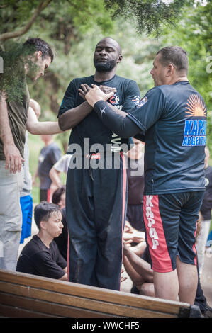 ISTANBUL, TURKEY - Maj 30 - Jun 02. 2019. Large group of international martial arts instructors and students have hard strength energy training on GEN Stock Photo