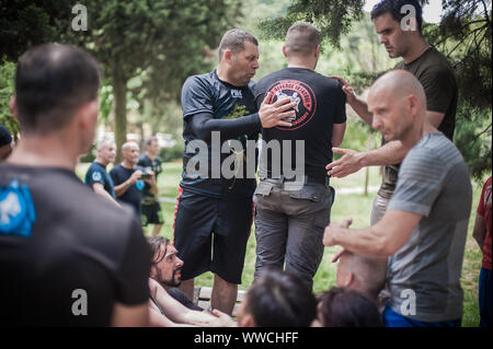 ISTANBUL, TURKEY - Maj 30 - Jun 02. 2019. Large group of international martial arts instructors and students have hard strength energy training on GEN Stock Photo