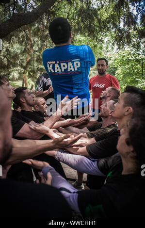 ISTANBUL, TURKEY - Maj 30 - Jun 02. 2019. Large group of international martial arts instructors and students have hard strength energy training on GEN Stock Photo