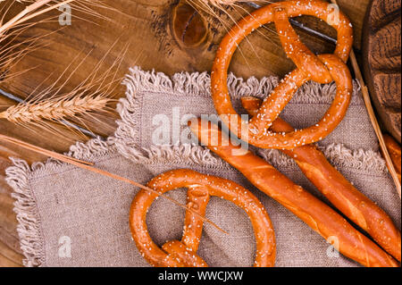 Traditional and pastry brezel for the beer festival. Wood background and decor. View from above Stock Photo