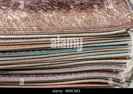 Traditional carpets for sell at a street market stall in Bodrum, Turkey. Close up Stock Photo