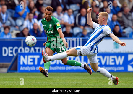 Huddersfield, UK. 15th Sep, 2019. Huddersfield, UK. 15 September 2019. The John Smiths Stadium, Huddersfield, Yorkshire, England; English Championship Football, Huddersfield Town Football Club versus Sheffield Wednesday; Jacob Murphy of Sheffield Wednesday crosses the ball under pressure from Lewis O'Brien of Huddersfield Town - Strictly Editorial Use Only. No use with unauthorized audio, video, data, fixture lists, club/league logos or 'live' services. Online in-match use limited to 120 images, no video emulation. No use in betting, games or single club/league/player publications Credit: Acti Stock Photo