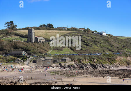 St Werburghs parish church overlooks Wembury Beach with its Old Mill tea rooms ans Marine Centre. Still quite busy out of season Stock Photo