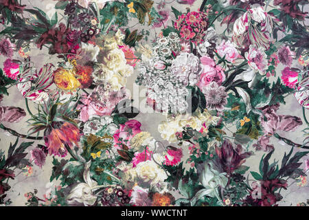 Fragment of a colorful retro fabric pattern with a floral ornament. Stock Photo