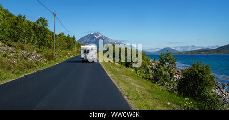 VR Caravan car travels on the highway. Tourism vacation and traveling. Beautiful Nature Norway natural landscape. Stock Photo