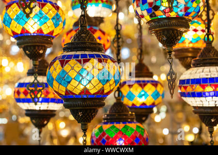 Oriental lamps from a multi-colored mosaic in the shop window. Stock Photo