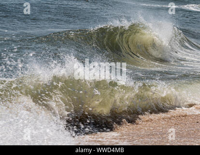 Rough waves of the Atlantic OCean breaking on the coast of Fire Island Long Island New York.