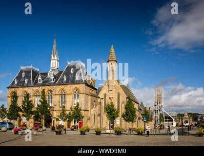 UK, County Durham, Bishop Auckland, Market Place, Town Hall, St Anne’s Church and Auckland Tower Stock Photo