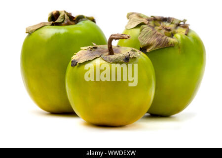 Green Diospyros kaki on a white background Stock Photo