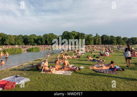 People enjoying the hot weather during the July 2019 heatwave in Englischer Garten (English Garden) in Munich, Bavaria, Germany. Stock Photo
