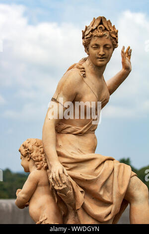 Hamadryad, a 17th century statue, seems to dance with a child on the South Terrace at the Biltmore Estate in Asheville, NC, USA Stock Photo