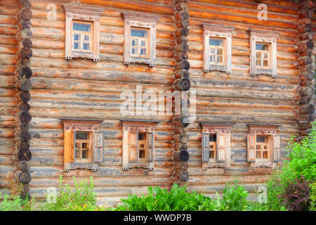 Old wooden two-story house in the village. Stock Photo