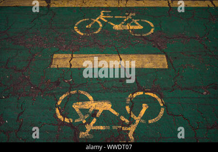 Bicycle sign on asphalt. Bicycle line in King Mihai I park (Herastrau park) in Bucharest, Romania, 2019. Stock Photo