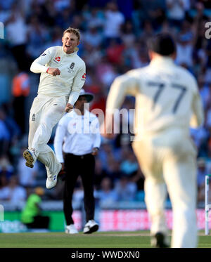England's Joe Root celebrates taking the wicket of Australia's Matthew Wade during day four of the fifth test match at The Kia Oval, London.