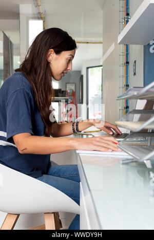 Architect woman working on some blueprints Stock Photo