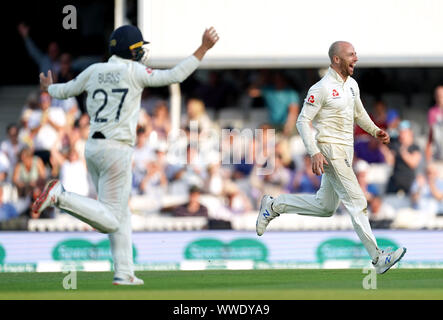 England's Jack Leach (right) celebrates after taking the wicket of Australia's Josh Hazlewood to secure victory during day four of the fifth test match at The Kia Oval, London. Stock Photo