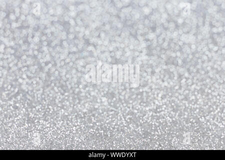 Abstract silver glitter background. Sparkle silver bokeh christmas background. Stock Photo
