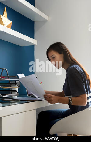 Architect woman working on some blueprints Stock Photo