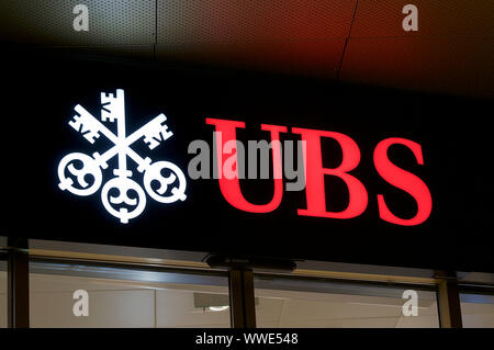 Lugano, Ticino, Switzerland - 17th August 2019 : Front view of the UBS Bank logo hanging in front of the building in the city of Lugano, Switzerland.