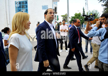 Marsa city, Tunis. 15th Sep, 2019. Youssef Chahid condidates to the 2019 presidential elections accompanied by his wife at the polling station at the Abderrahmen Mami school at the Marsa City in Tunis during the first round of the presidential election in Tunisia this Sunday, September 15th. Credit: Chokri Mahjoub/ZUMA Wire/Alamy Live News Stock Photo