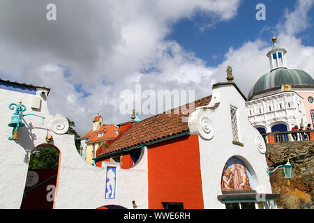 Portmeirion, UK: September 01, 2019: Beautiful Italian style buildings in Portmeirion with a water fountain and lookout point in the cliff. Stock Photo