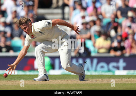 LONDON, ENGLAND. 15 SEPTEMBER 2019: Sam Curran of England fields the ball off his own bowling during day four of the 5th Specsavers Ashes Test Match, at The Kia Oval Cricket Ground, London, England. Stock Photo