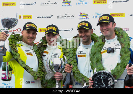 Derby, UK. 15th Sep, 2019. 2019 British GT champions from left to right, GT4 champions TF Sport drivers Ashley Hand & Tom Canning and GT3 champions TF Sport drivers Jonny Adam & Graham Davidson during the British GT Donington Park GP at Donington Park, Derby, England on 15 September 2019. Photo by Jurek Biegus. Editorial use only, license required for commercial use. No use in betting, games or a single club/league/player publications. Credit: UK Sports Pics Ltd/Alamy Live News Stock Photo