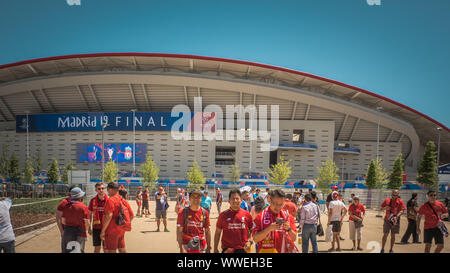 Madrid / Spain - 06 01 2019: Soccer fans are taking pictures in front of the Wanda Metropolitano stadium the UEFA Champions League before the finals Stock Photo