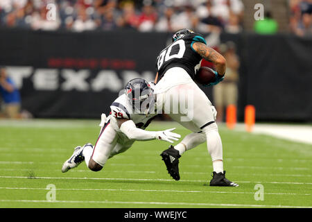 Houston, Texas, USA. 15th Sep, 2019. Houston Texans safety Tashaun Gipson (39) tackles Jacksonville Jaguars tight end James O'Shaughnessy (80) after a pass reception during the fourth quarter of the NFL regular season game between the Houston Texans and the Jacksonville Jaguars at NRG Stadium in Houston, TX on September 15, 2019. Credit: Erik Williams/ZUMA Wire/Alamy Live News Stock Photo