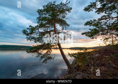 Picturesque stone shore of the island on the lake . Ladoga Skerries, Karelia. Stock Photo
