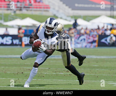 New Orleans Saints corner back Jabari Greer holds his children