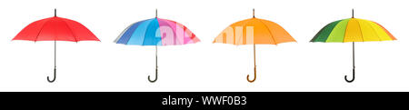 Different stylish umbrellas on white background Stock Photo
