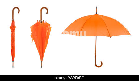 Stylish orange umbrellas on white background Stock Photo