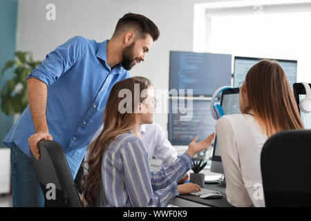 Team of programmers working in office Stock Photo