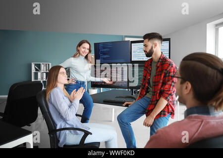Team of programmers working in office Stock Photo