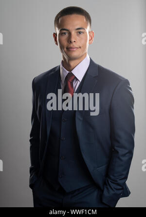 Handsome mixed race young man wearing business suit Stock Photo