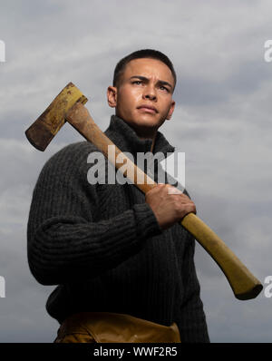 Handsome and muscular lumberjack man with an axe, camping. Man with axe ...