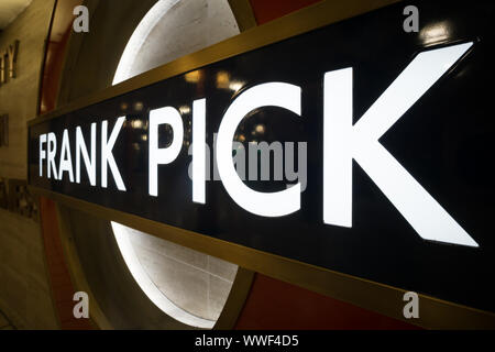Close up of London underground roundel with the name Frank Pick in Piccadilly underground station, London. Stock Photo
