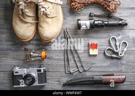 Set of items for camping on wooden background Stock Photo
