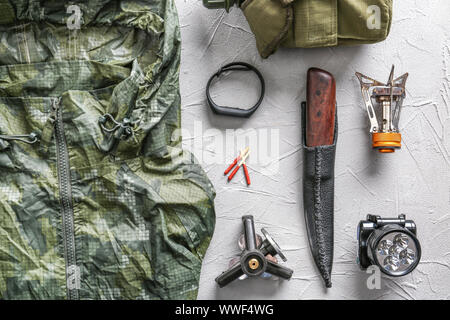 Set of items for camping on grey background Stock Photo